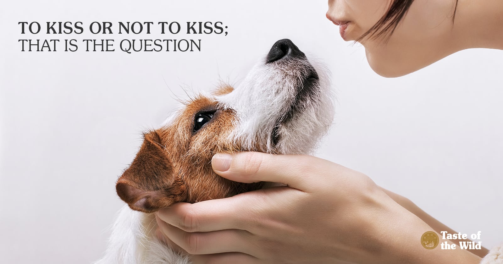 Close-Up Female Dog Owner Kissing Terrier Dog | Taste of the Wild